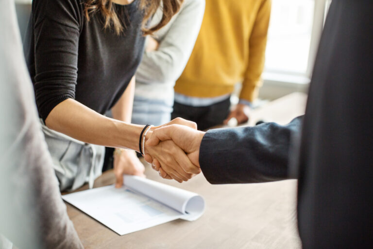 Business people shaking hands in office