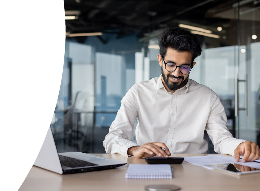 young male accountant working focused in office